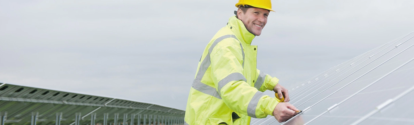 Man working on solar panels