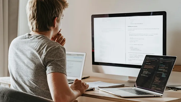 tech professional working on computer