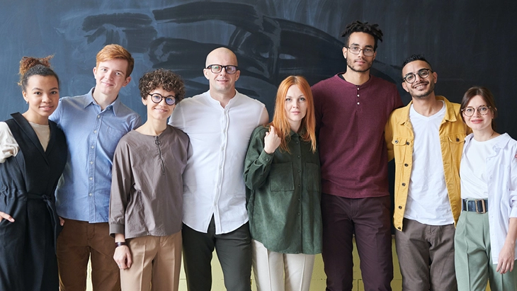 Colleagues standing and smiling