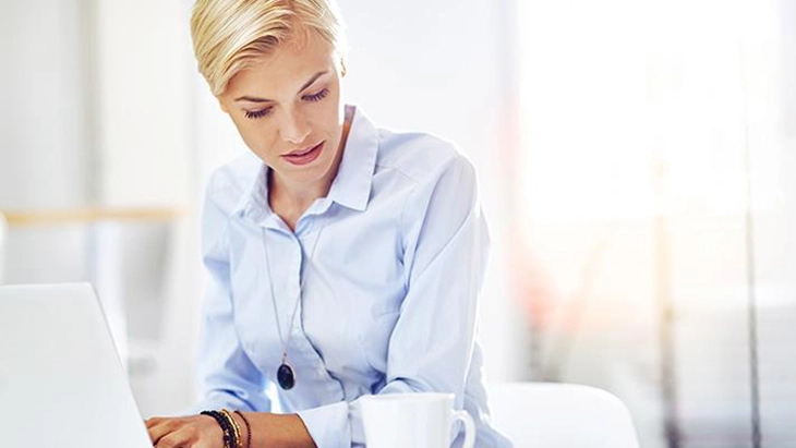 Woman typing on laptop