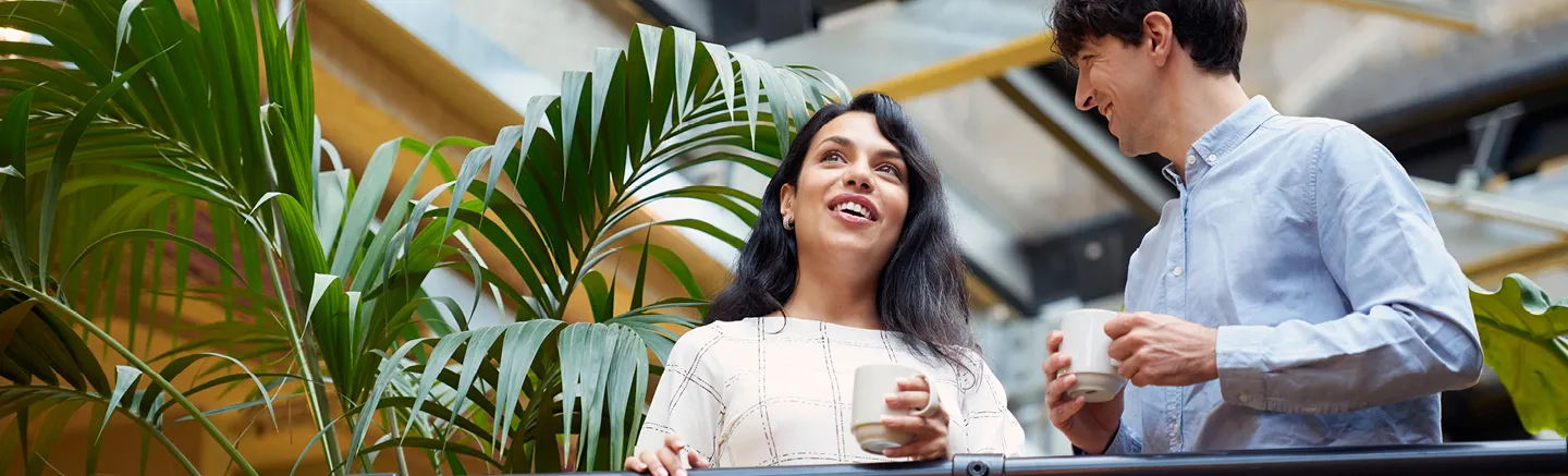 Diverse professionals collaborating in a modern office, highlighting innovation and teamwork in tech start-ups and scale-ups.