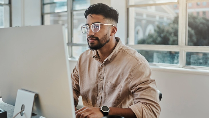 Man applying for jobs on computer